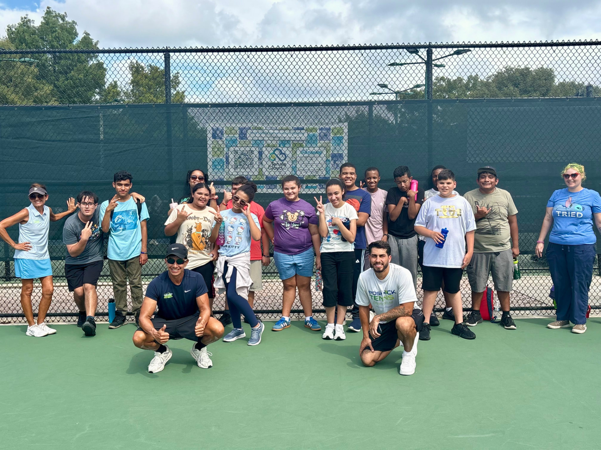 Group of PRTF players and coaches together on the tennis court